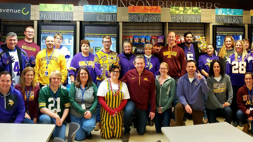 Staff members wearing sports teams apparel